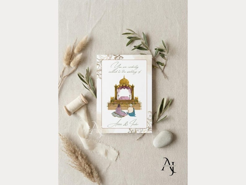 A single wedding invitation card featuring an altar illustration lies on a neutral fabric background surrounded by dried botanical stems and a smooth stone.