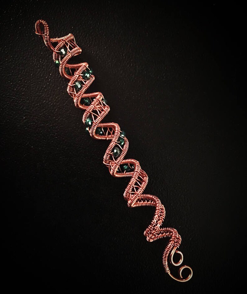 Boho copper hair wrap with a unique bead, perfect for festival