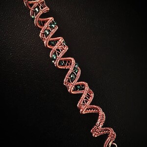 Copper hair twist with bead embellishment for braids.