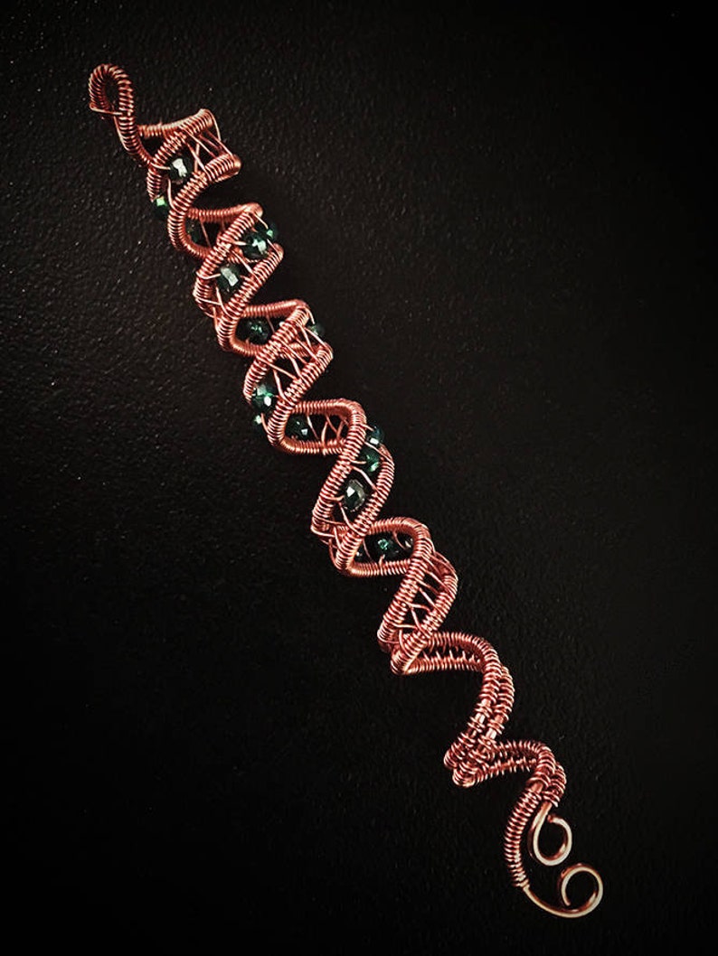 Copper hair twist with bead embellishment for braids.
