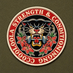 May include: A circular embroidered patch featuring a black panther head with an open mouth biting a gray dumbbell. The design is surrounded by red hibiscus flowers and a red border with the white text CCOOLOOLA STRENGTH & CONDITIONING.