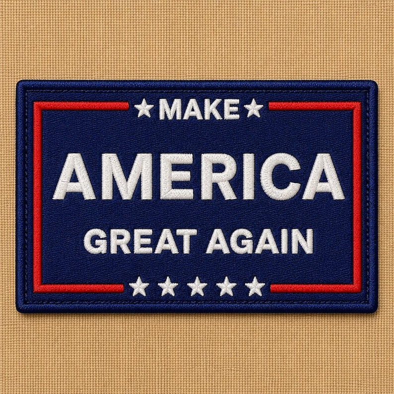 May include: A rectangular patch with a navy blue background and a red border. The words "MAKE AMERICA GREAT AGAIN" are embroidered in white. The patch has stars at the top and bottom.