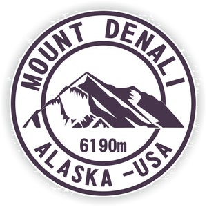 May include: A black and white circular stamp with the text "MOUNT DENALI ALASKA - USA" and "6190m" inside. The stamp features a stylized image of a mountain.
