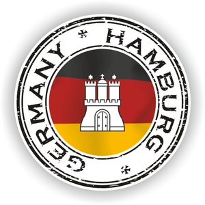 May include: A black and white distressed circular stamp with the text "GERMANY HAMBURG" around the edge. The centre of the stamp features the German flag with the Hamburg city coat of arms in the centre.