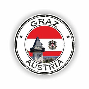 以下が含まれることがあります： 「GRAZ」と「AUSTRIA」の文字が黒色で書かれた丸いステッカー。中央にはオーストリアの国旗、時計塔、オーストリアの紋章が描かれています。