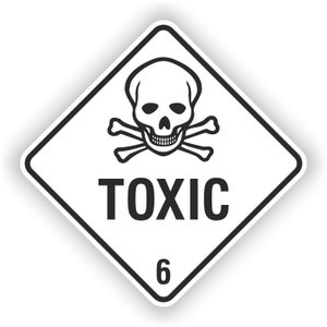 May include: A white diamond-shaped warning sign with a black skull and crossbones and the word "TOXIC" in black letters. The number "6" is printed in black at the bottom of the sign.
