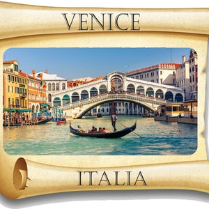 May include: A vintage-style scroll with a picture of the Rialto Bridge in Venice, Italy. The bridge is a white stone arch bridge over a canal with a gondola in the water. The scroll has the words "VENICE" and "ITALIA" on it.