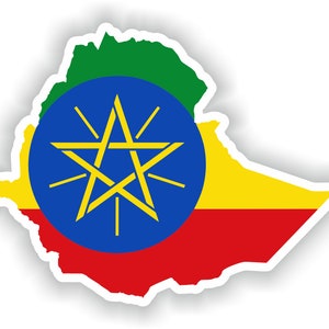 Puede incluir: Una pegatina con el contorno de Etiopía con los colores de la bandera etíope: verde, amarillo, rojo y un círculo azul con una estrella amarilla en el centro.