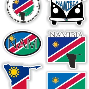 May include: A set of six stickers featuring the Namibian flag and the word "Namibia". The stickers are in various shapes and sizes, including a circle, oval, rectangle, and the outline of Namibia. The stickers are perfect for decorating laptops, water bottles, or anything else you can think of.