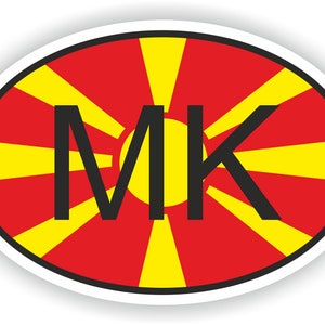 Könnte beinhalten: Ein ovaler Aufkleber mit einer stilisierten Sonne in Rot und Gelb und den Buchstaben "MK" in Schwarz.