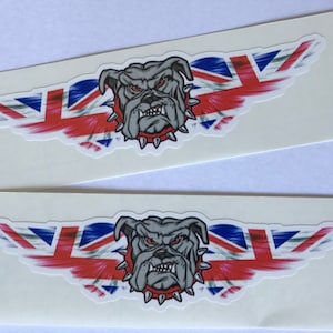May include: Two stickers featuring a cartoon bulldog with a red collar and spikes, with a red, white, and blue British flag design behind it.