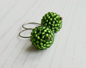 Handmade artisan bead drop earrings - handwoven glass rounds in a glowing moss green - with recycled sterling silver earwires