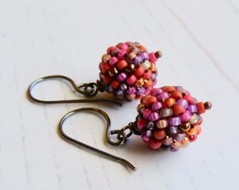 Jeanette - handmade artisan bead earrings in orange magenta pink medley with sterling silver earwires