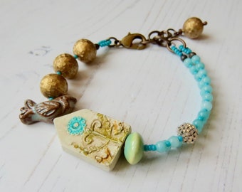 Handmade artisan bead bracelet in aqua and gold - Happy Day - Songbead, UK, narrative jewelry