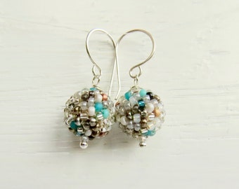 Handmade artisan handwoven glass bead earrings in bright silver and turquoise - Arctic Light - with recycled sterling silver earwires