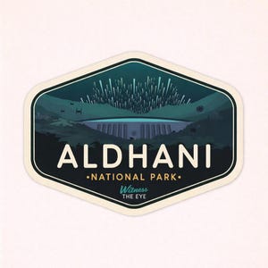 May include: A sticker with a hexagonal shape featuring a landscape scene. The design includes a dam, mountains, and a night sky with a burst of white lines. The text "ALDHANI NATIONAL PARK" and "Witness THE EYE" are also present.