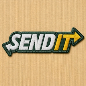 May include: Embroidered patch with the words "SEND IT" in white, outlined in dark green, with a yellow arrow pointing right. The patch is on a tan fabric background.