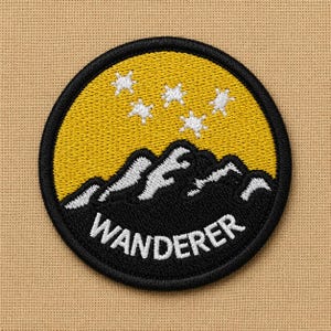 May include: Embroidered patch featuring a black mountain range silhouette with white accents under a yellow sky with white star shapes. The word "WANDERER" is embroidered in white on a black border.