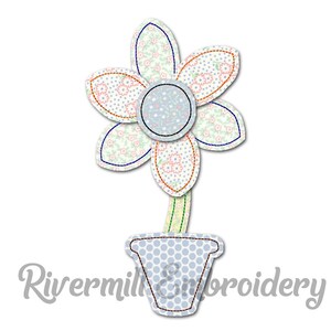 May include: A blue and white flower with a patterned design is in a blue and white polka dot pot. The flower has six petals and a yellow stem.