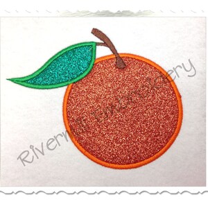 May include: An orange embroidery design with a green leaf. The orange is a solid orange color with a glittery texture. The leaf is a solid green color with a glittery texture.
