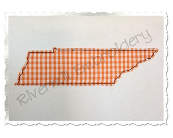 May include: An orange and white gingham fabric in the shape of the state of Tennessee. The fabric is outlined in black thread.