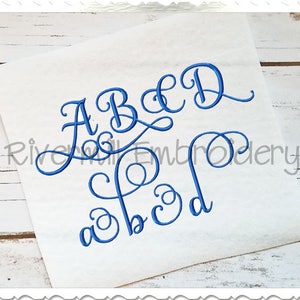 May include: Embroidery design of the alphabet in a cursive font. The letters A, B, C, D are shown in uppercase and lowercase.