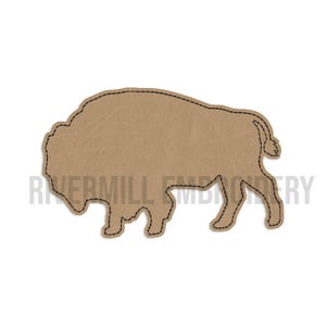 May include: A tan bison-shaped patch with black stitched outline. The patch has a textured appearance and the text "RIVERMILL EMBROIDERY" is printed in gray at the bottom of the image.