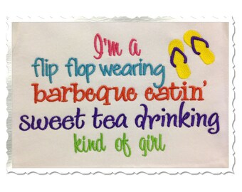 May include: Embroidered design on a white fabric background with the text "I'm a flip flop wearing barbeque eatin' sweet tea drinking kind of girl" in colorful lettering. Two yellow flip flops are embroidered above the text.