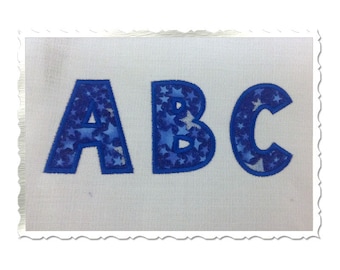 May include: Blue fabric letters with a white star pattern spelling out "ABC".