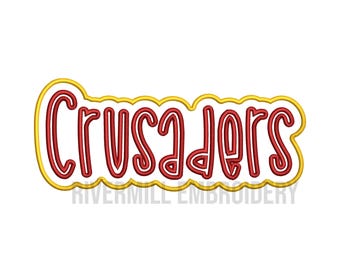 May include: Red embroidered text "Crusaders" with a yellow outline. The text is in a stylized font with rounded edges. The text is surrounded by a yellow wavy line.
