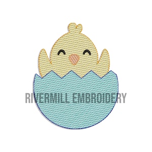 May include: A yellow chick with closed eyes peeks out of a blue and white speckled egg shell. The chick has a small orange beak and a happy expression.