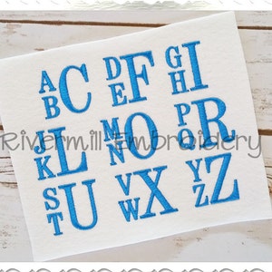 May include: A set of uppercase letters in a blue font on a white background. The letters are arranged in alphabetical order.