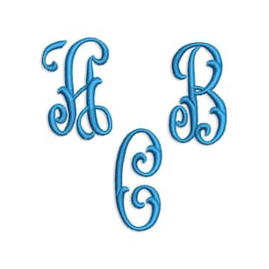 May include: Three embroidered letters: A, B, and C, in a flowing script font. The letters are a vibrant teal blue color and appear to be stitched onto a white background. The design is suitable for monograms.