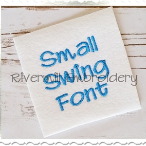 May include: A white fabric swatch with the text "Small Swing Font" embroidered in blue thread.