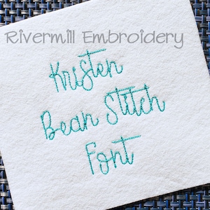 May include: A white fabric with teal blue embroidery that reads "Rivermill Embroidery", "Kristen", "Bean Stitch Font".