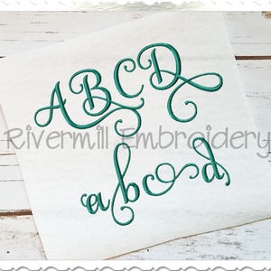 May include: Embroidery design featuring the letters A, B, C, and D in a cursive font. The letters are in teal and are arranged in a decorative pattern. The text "Rivermill Embroidery" is also visible in the image.