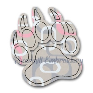 May include: A black and white bear paw print with a gray and pink geometric pattern. The paw print is outlined in black.