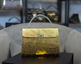 The Fleur Dorada Gold Metallic Leather Handbag: Silver Handle, DM Lock