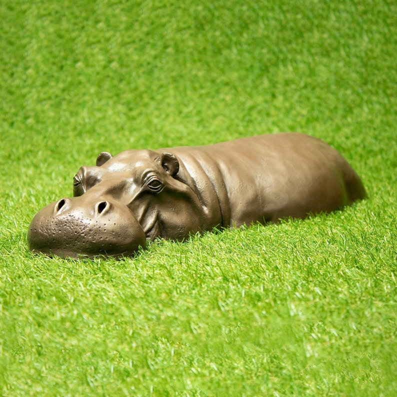 Bronze resin hippo garden ornament. Designed to look as though it's half submerged in a lake in Africa. Great idea for a new garden gift or housewarming gift.