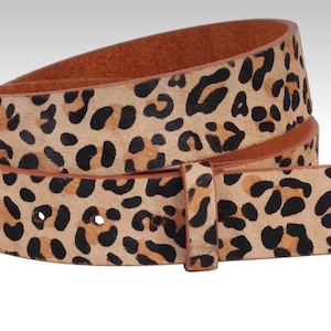 May include: A brown leather belt with a leopard print pattern. The belt has a buckle and is made of a soft, supple leather.
