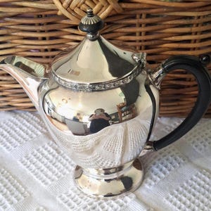 Vintage, curved, decorative,  1930s-40's Du Barry silverplated  art deco teapot with bakelite handle and knob finials (15 cms high, 12cms)