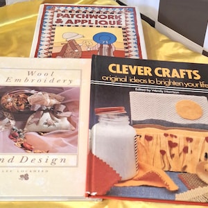 May include: Three hardback craft books titled Patchwork & Appliqué, Wool Embroidery and Design by Lee Lockheed, and Clever Crafts: original ideas to brighten your life edited by Wendy Morrison, featuring illustrations of fabric projects.