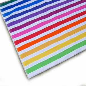 Modern geometric striped baby quilt in rainbow colors