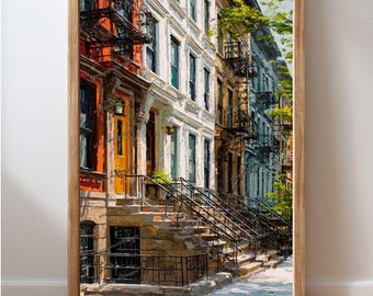 May include: A framed art print depicting a street of terraced houses. The buildings are painted in vibrant colours, including red, white, yellow, and blue. The artwork has a painterly style, with visible brushstrokes. The print is in a wooden frame.