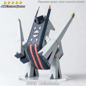 May include: A hand-painted resin figure of Archaludon, a robotic-looking creature. The figure is primarily white, with a dark blue central section and red and gold accents. The base is clear, and the figure is labeled with the text "#1018 Archaludon".
