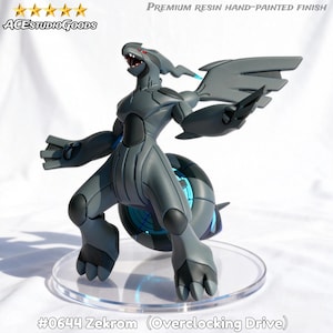 May include: A gray Zekrom figurine with a hand-painted finish, standing on a clear base. The figure has a dynamic pose with outstretched arms and wings. The text "ACESTUDIO GOODS" and "PREMIUM RESIN HAND-PAINTED FINISH" are visible. The figure is labeled "#0644 Zekrom (Overclocking Drive)."