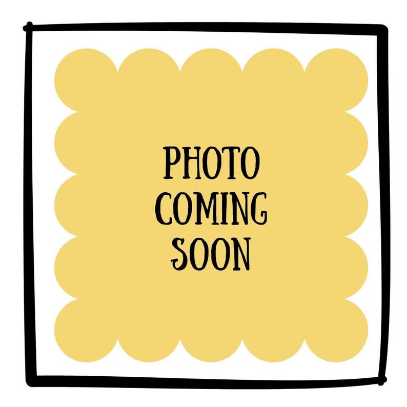 May include: A square graphic with a thick black border enclosing a pale yellow scalloped shape. Centered within the yellow area is the black text "PHOTO COMING SOON" written in a simple, sans-serif font. The design is flat and minimalist.
