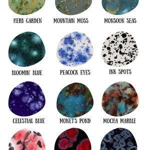 May include: Twelve irregular circular ceramic glaze samples labeled Herb Garden, Mountain Moss, Monsoon Seas, Bloomin' Blue, Peacock Eyes, Ink Spots, Celestial Blue, Monet's Pond, Mocha Marble, Poppy Fields, Black Opal, and Obsidian.
