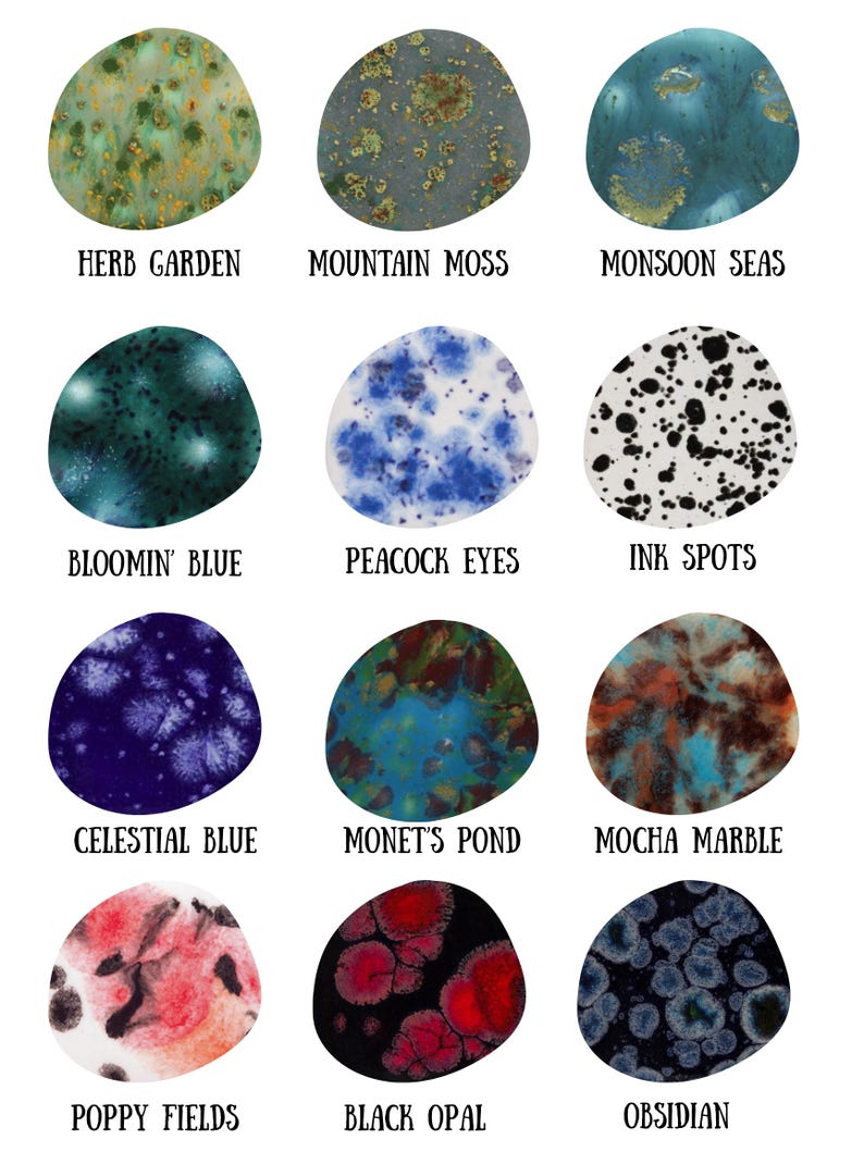 May include: Twelve irregular circular ceramic glaze samples labeled Herb Garden, Mountain Moss, Monsoon Seas, Bloomin' Blue, Peacock Eyes, Ink Spots, Celestial Blue, Monet's Pond, Mocha Marble, Poppy Fields, Black Opal, and Obsidian.