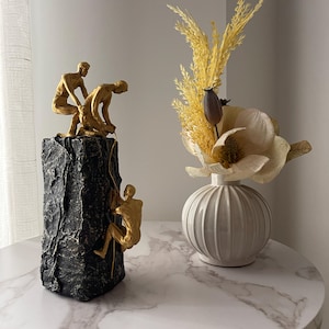 Golden sculpture “The Support” – Modern statue – Climbers – Inspiring decoration